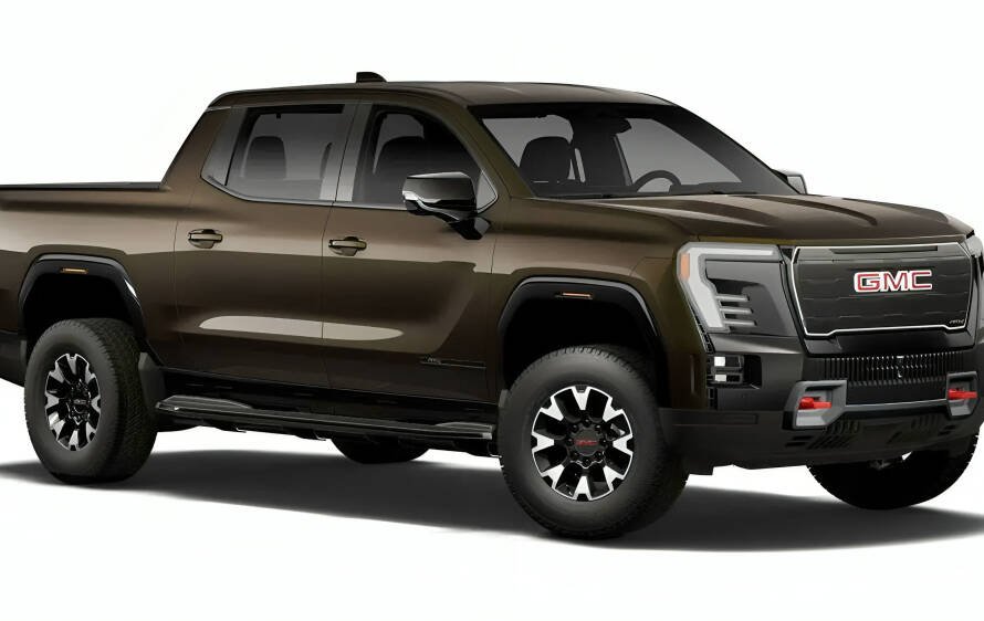 Pickup eléctrica GMC Sierra EV en color Deep Bronze Metallic estacionada en exteriores