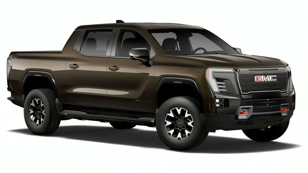 Pickup eléctrica GMC Sierra EV en color Deep Bronze Metallic estacionada en exteriores